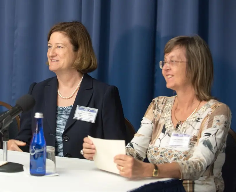 Dr. Kelly Clark and Dr. Annie Umbricht at a panel table