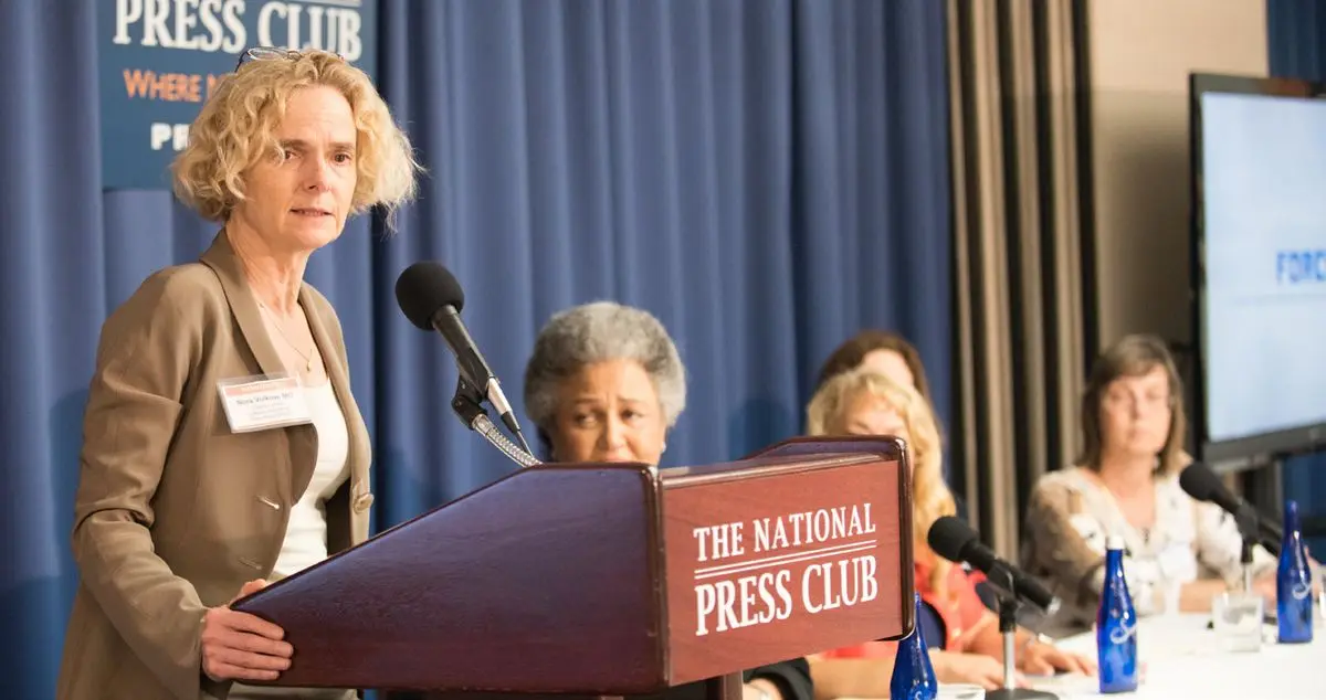 Dr. Nora Volkow speaking at the National Press Club lectern